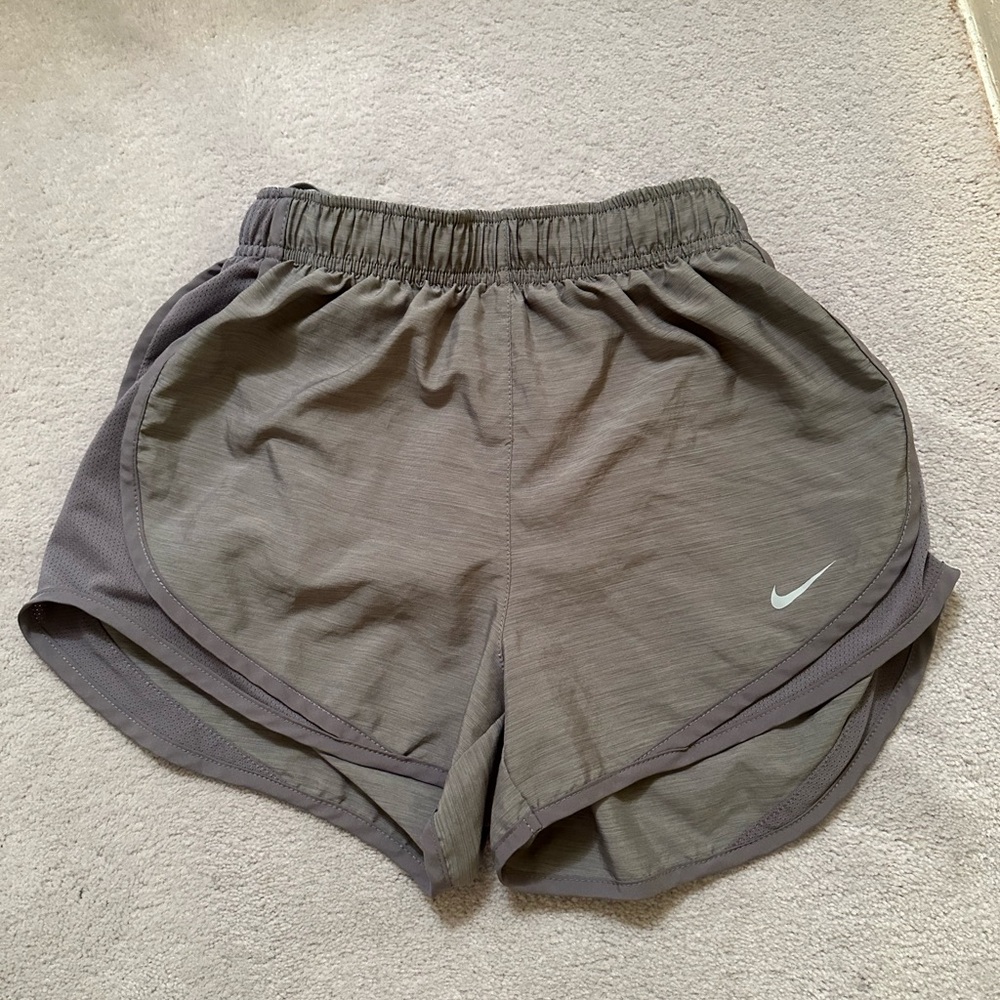 Grey Nike running shorts.